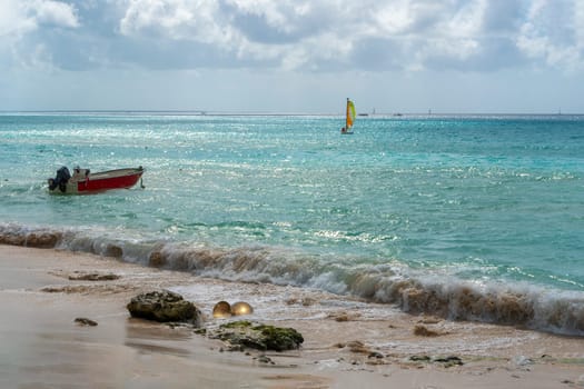 Ocean panorama with bronze amphora and sailboat