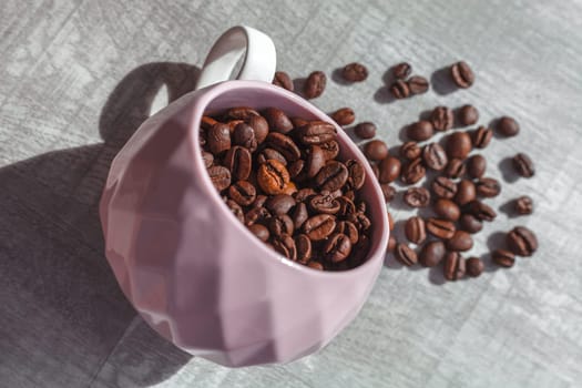 coffee beans in cup on the table and coffee beans around cup