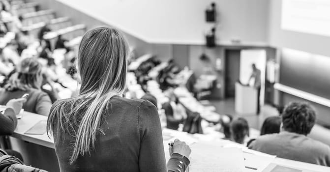 Conference and Presentation. Audience at the conference hall. Business and Entrepreneurship. Faculty lecture and workshop. Audience in the lecture hall. Academic education. Student making notes.