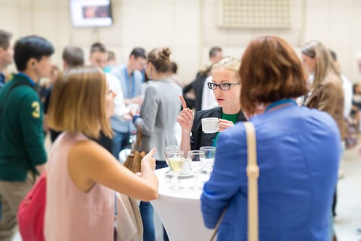 Expert people interacting during coffee break at business, medical or scientific conference.