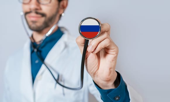 Russia flag on stethoscope. Doctor holding stethoscope with flag of Russia. Doctor showing stethoscope with flag of Russian Federation