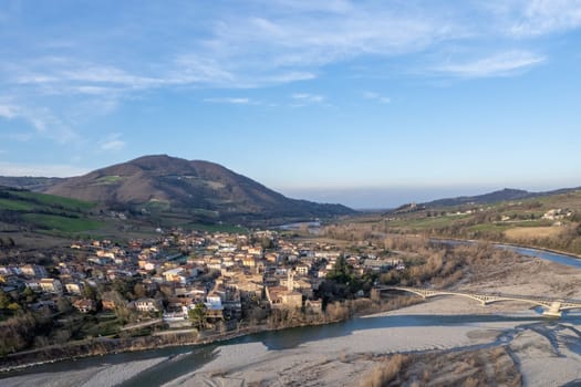 Aerial scenic view of Travo Village, Trebbia river, Valley landscape, Piacenza Italy at sunset