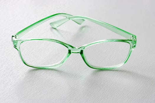 Light green modern glasses. Fashion summer concept. Copy space. vision improvement,