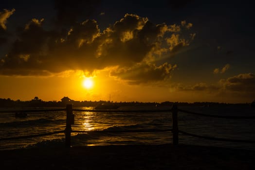 Sea beach with sky sunset or sunrise. Clouds over the sunset sea. Sunset at tropical beach. Nature sunset landscape of beautiful tropical sea.