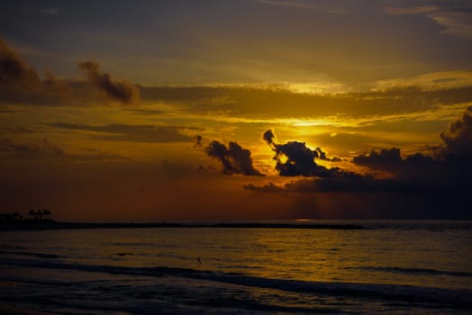 Sea beach with sky sunset or sunrise. Clouds over the sunset sea. Sunset at tropical beach. Nature sunset landscape of beautiful tropical sea.