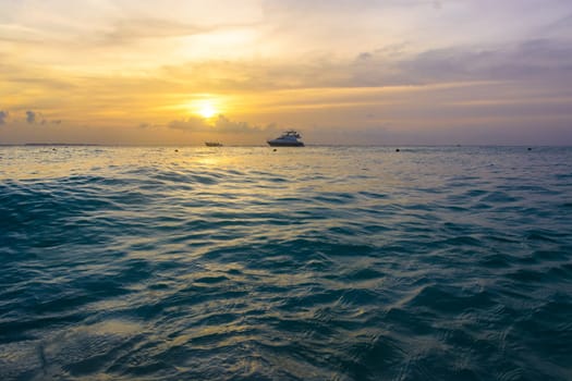 Sea beach with sky sunset or sunrise. Clouds over the sunset sea. Sunset at tropical beach. Nature sunset landscape of beautiful tropical sea.