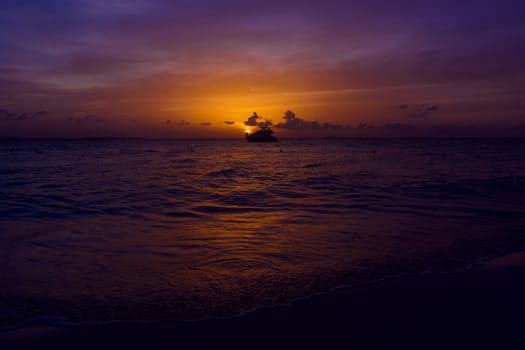 View of the yacht on the sea at sunset.