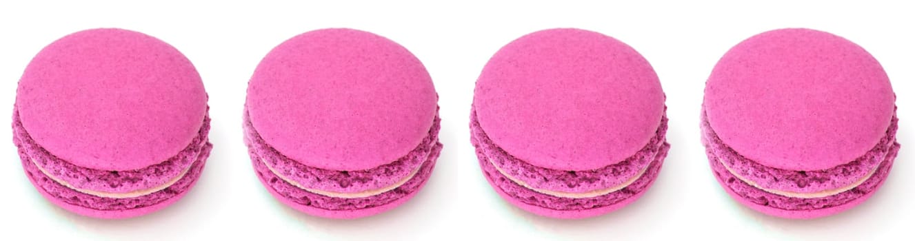 four pink macaroon with shadow on isolate. Raspberry macaroons on a white background. Pink cream in pink cakes. High quality photo