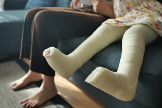 little child boy with plaster bandage on leg