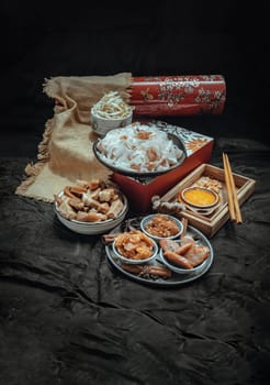 Chinese steamed flat wide rice noodles with Braised pork, Tofu, Crisp squid in sweet soy sauce and Bean sprout, Chinese sausage sliced, Fried dried shrimp and Pickle turnip serve with pickled chili. Asian food style, Space for text, Selective focus.