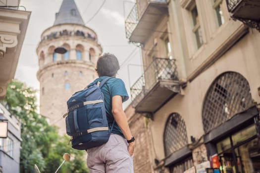 Portrait of man tourist with view of Galata tower in Beyoglu, Istanbul, Turkey. Turkiye.