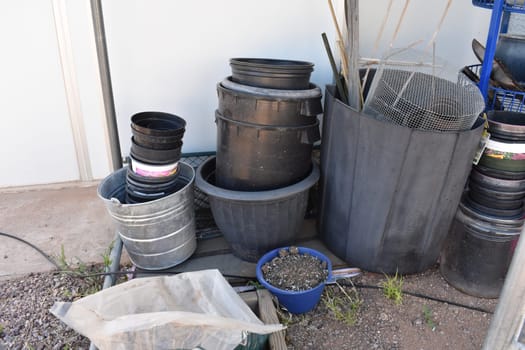 Stacked Plastic Gardening Pots for Plants in Backyard in Arizona . High quality photo