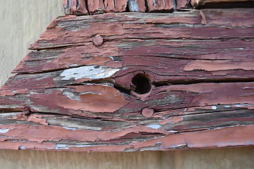 Peeling Old Red Paint on Wood Trim Vintage Texture. High quality photo