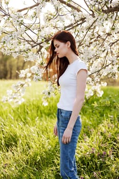 Young woman with cherry flowers portrait. High quality photo