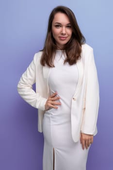 positive confident dark-haired woman in white outfit.