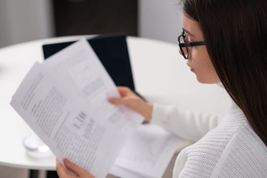 Businesswoman analyzing company financial data or statistical results using laptop. Financial analyst prepares annual report