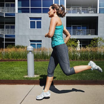 You deserve to look your best. an attractive young female runner exercising outdoors