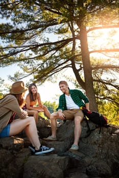 When you travel, take the scenic route. three young people hiking while on an overseas trip