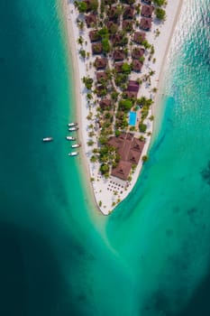 Koh Mook tropical Island in the Andaman Sea in Thailand, tropical beach with white sand and turqouse colored ocean with coconut palm trees. Drone aerial view of an tropical Island