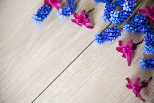 beautiful bouquet of spring flowers on a wooden table, rustic style.