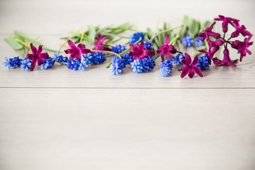 beautiful bouquet of spring flowers on a wooden table, rustic style.