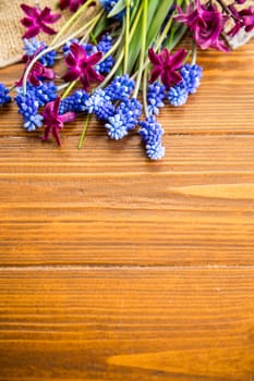 beautiful bouquet of spring flowers on a wooden table, rustic style.