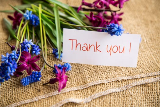 beautiful bouquet of spring flowers on a wooden table, rustic style.