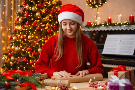 Girl packing Christmas gift boxes and making decor for the house