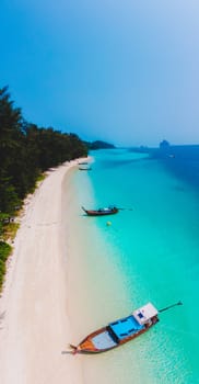 Koh Kradan Island with a white tropical beach and turqouse colored ocean.