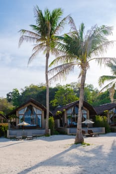 Bungalow on the beach of an Island in Thailand, wooden villa on the beach with palm trees
