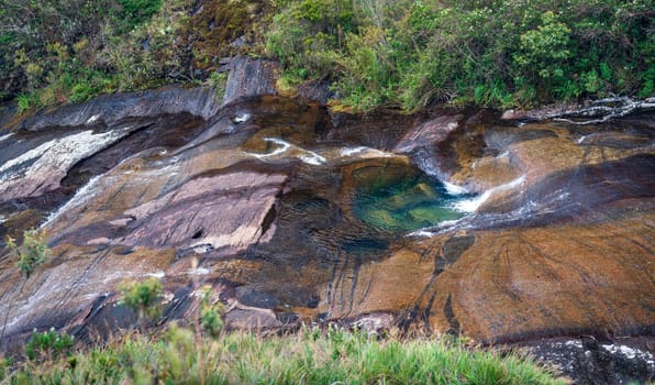 Discover the stunning beauty of this rocky river with its bright green pools surrounded by slippery walls.