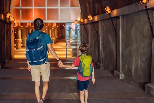 father and son tourists enjoying Beautiful cistern in Istanbul. Cistern - underground water reservoir build in 6th century, Istanbul, Turkey, Turkiye.