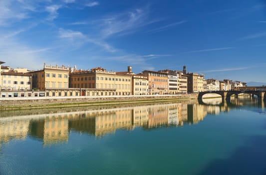 View of the river Arno and buildings from the embankment in Florence. High quality photo