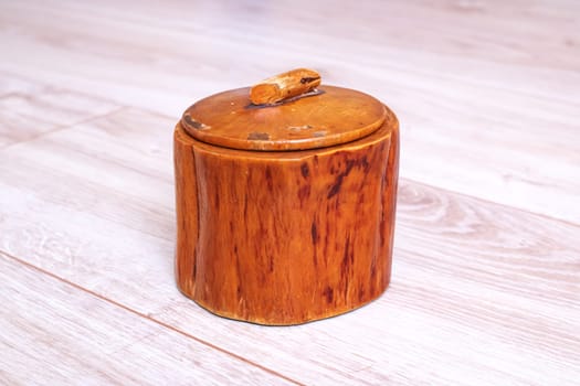 Wooden box with threads and needles close up