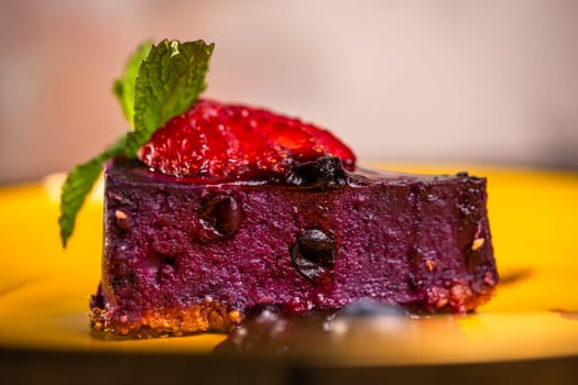 berry dessert with strawberries on a yellow plate