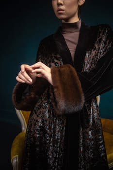 a girl in a fur outfit. sleeves made of natural fur.