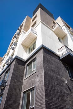 bottom view of a multi-storey building and the sky background. copy space.