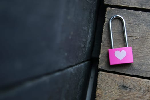 Pink padlock with a heart. Creative Romantic background.