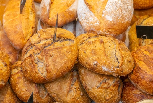 Netherlands. Farmers market in Amsterdam. Many loaves of breads close-up