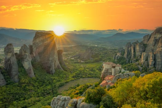 Summer sunset in the Greek Meteora. Monastery on the rock, listed by UNESCO