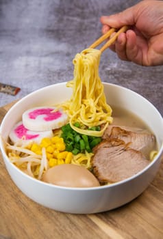 Fresh ramen noodles with garnish, pork tenderloin, eggs marinated in Mirin and soy sauce, bean sprouts, corn, nori leaf, spring onion, and homemade Narutomaki with codfish back, Hight quality