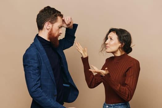 Man and woman couple in a relationship quarrel, yelling, psychological violence in the family, problems in a real relationship between people. High quality photo
