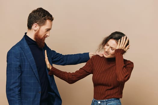 Man and woman couple in a relationship quarrel, yelling, psychological violence in the family, problems in a real relationship between people. High quality photo