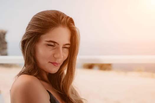 Happy woman portrait in cafe. Boho chic fashion style. Outdoor photo of young happy woman with long hair, sunny weather outdoors sitting in modern cafe