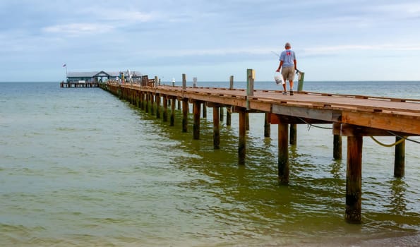 FLORIDA, USA - NOVEMBER 28, 2011: wooden pier with a restaurant on the shore in the Gulf of Mexico, Florida