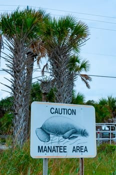 FLORIDA, USA - NOVEMBER 28, 2011: Manatee information sign on the Gulf of Mexico in Florida