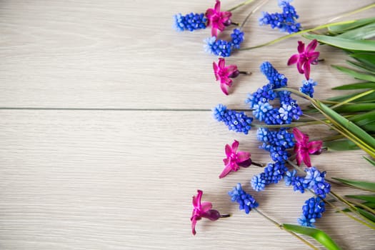 beautiful bouquet of spring flowers on a wooden table, rustic style.