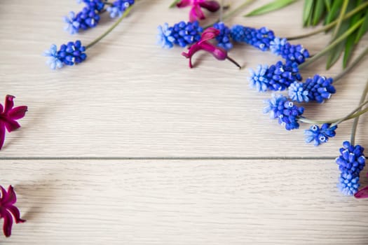 beautiful bouquet of spring flowers on a wooden table, rustic style.