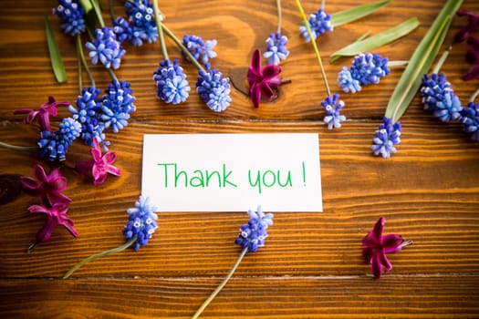 beautiful bouquet of spring flowers on a wooden table, rustic style.