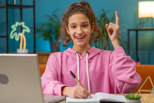 Eureka. Thoughtful clever inspired Caucasian preteen school girl excited with good idea, inspiration motivation, find out question answer. Young child, kid at home workplace sitting at desk workplace
